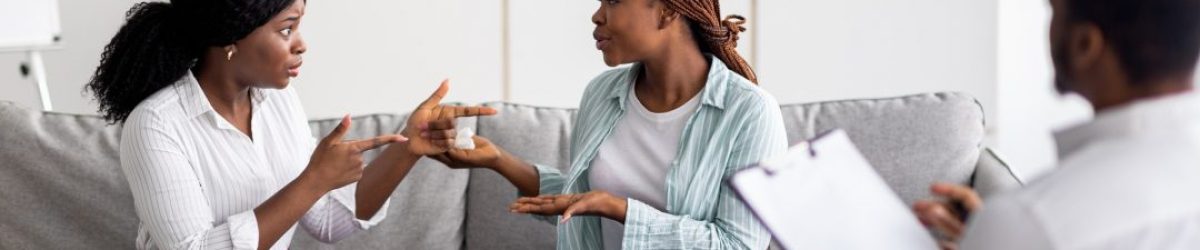 african-american-lesbian-couple-having-consultation-with-psychologist-at-office.jpg